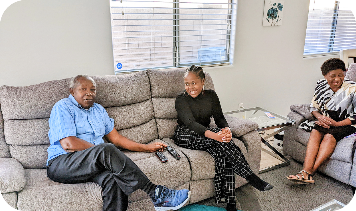 A man and woman relaxing on a counch